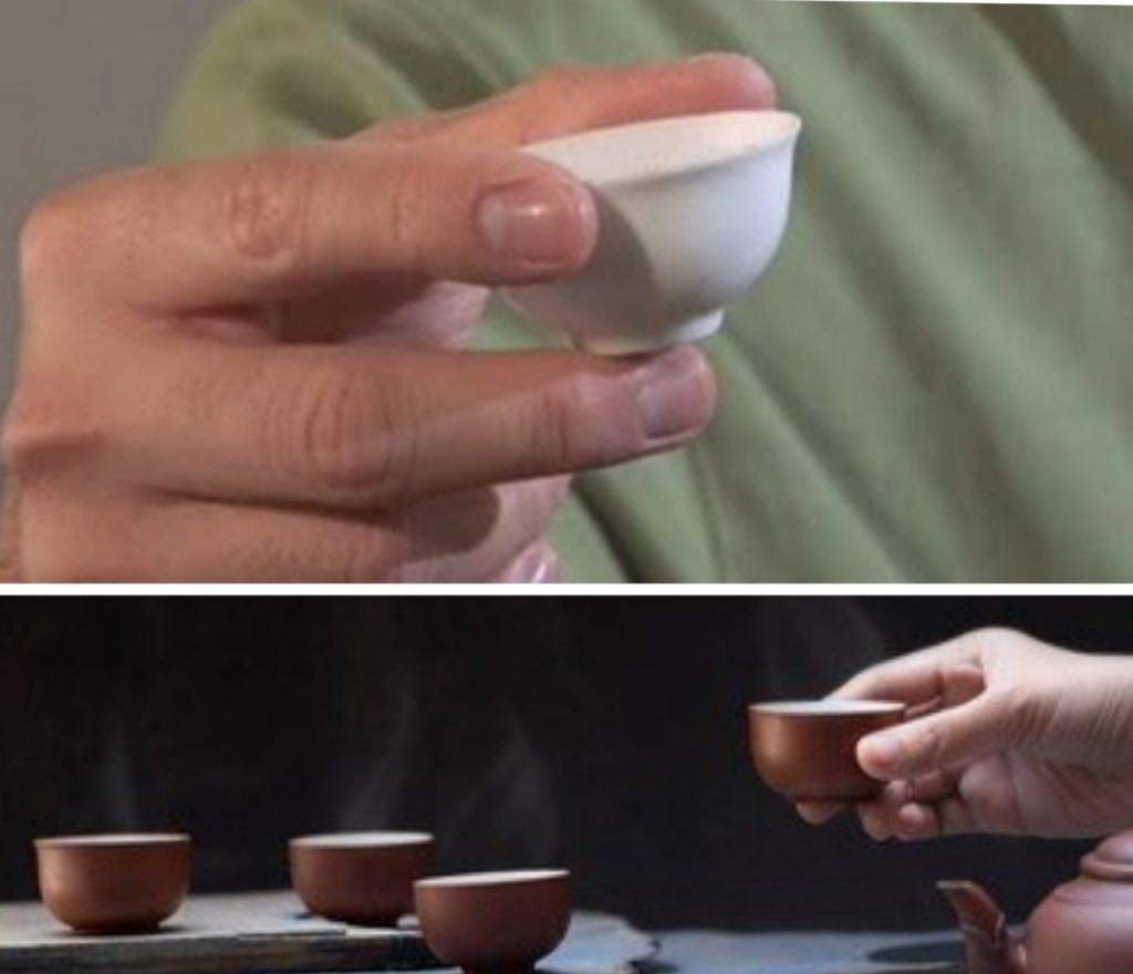 cầm chén uống trà